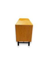 Cargar imagen en el visor de la galería, Wooden cabinet with black legs on a white background
