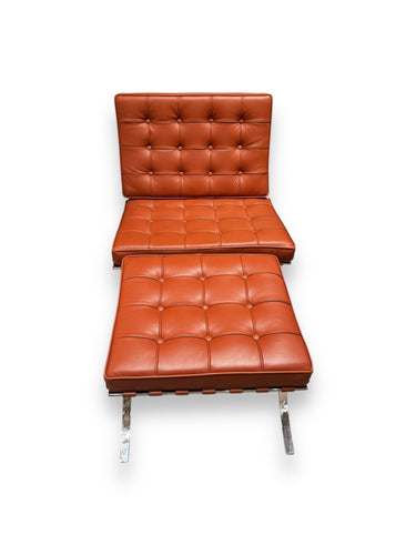 Brown leather chaise lounge chair on a white background