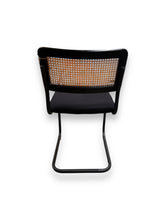 Cargar imagen en el visor de la galería, Black office chair with woven backrest on a white background
